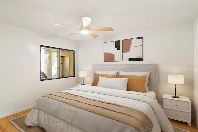 825 S Osprey Ave Unit 302, Sarasota, FL 34236 - bedroom featuring baseboards, ceiling fan, and wood finished floors