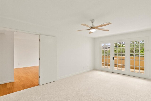 825 S Osprey Ave Unit 302, Sarasota, FL 34236 - spare room with baseboards, ceiling fan, french doors, and carpet