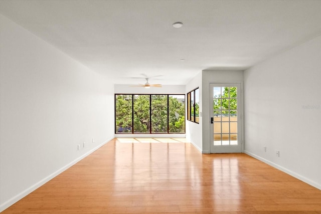 825 S Osprey Ave Unit 302, Sarasota, FL 34236 - spare room featuring a ceiling fan, baseboards, and light wood-style floors