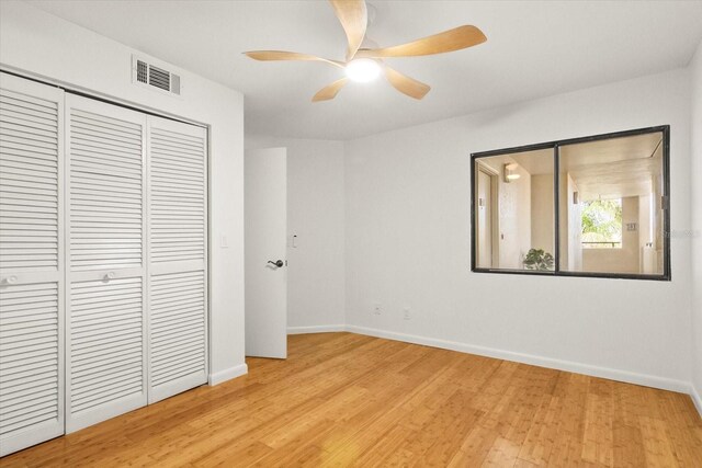 825 S Osprey Ave Unit 302, Sarasota, FL 34236 - unfurnished bedroom with a closet, baseboards, light wood-style flooring, and visible vents
