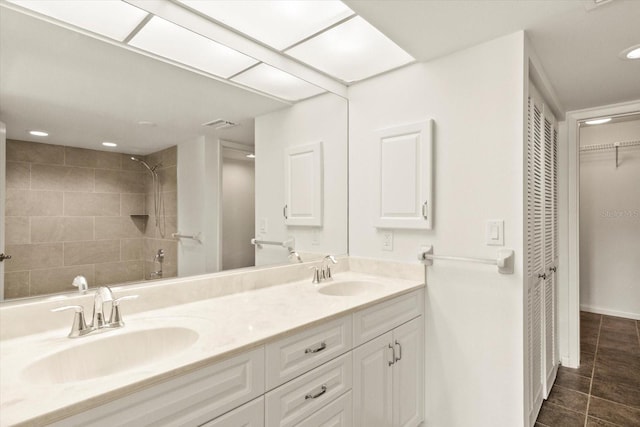 825 S Osprey Ave Unit 302, Sarasota, FL 34236 - full bath with tiled shower, a sink, double vanity, and a closet