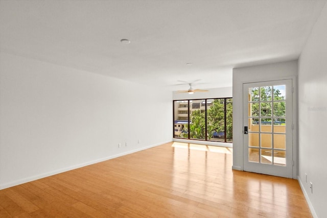 825 S Osprey Ave Unit 302, Sarasota, FL 34236 - empty room featuring light wood finished floors, baseboards, and a ceiling fan