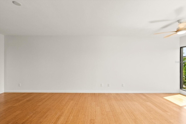 825 S Osprey Ave Unit 302, Sarasota, FL 34236 - empty room featuring baseboards, ceiling fan, and light wood finished floors