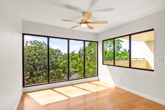 825 S Osprey Ave Unit 302, Sarasota, FL 34236 - spare room with a ceiling fan, baseboards, and wood finished floors