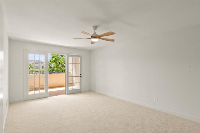 825 S Osprey Ave Unit 302, Sarasota, FL 34236 - spare room featuring baseboards, carpet floors, french doors, and a ceiling fan