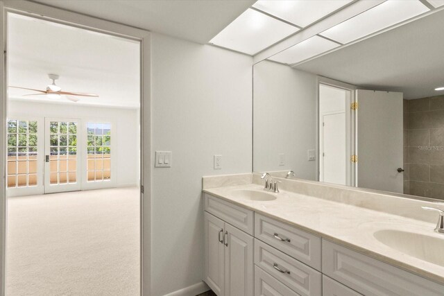 825 S Osprey Ave Unit 302, Sarasota, FL 34236 - bathroom featuring a ceiling fan, double vanity, a sink, and baseboards