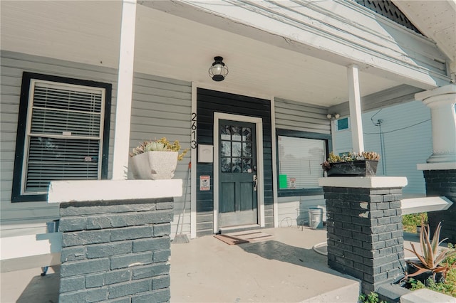 entrance to property featuring covered porch