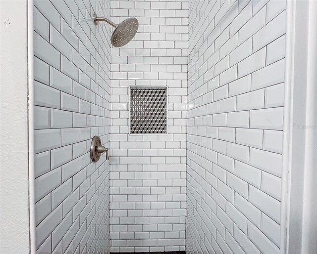 full bathroom with tiled shower