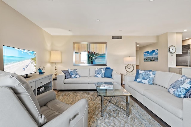 living room with recessed lighting and visible vents
