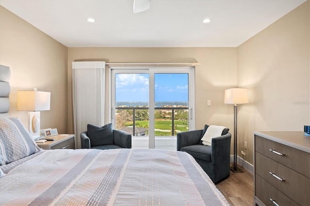 bedroom with baseboards, light wood-type flooring, and recessed lighting