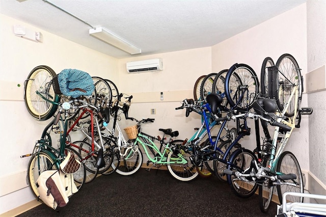 garage with bike storage and an AC wall unit
