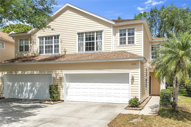 view of front of property with driveway and an attached garage