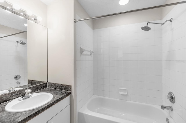 full bathroom with washtub / shower combination and vanity