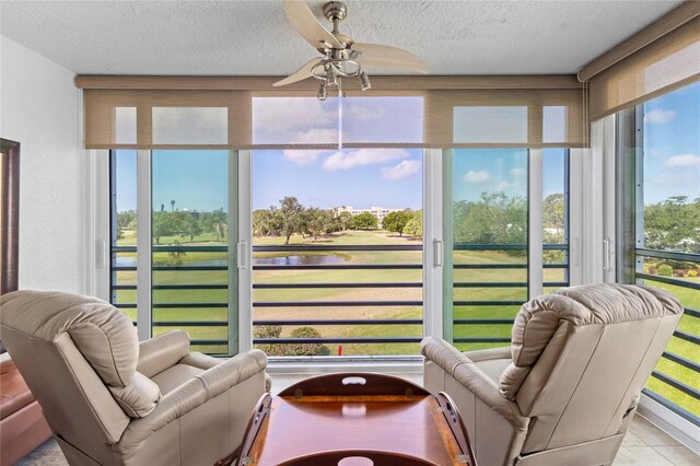 sunroom featuring a textured ceiling