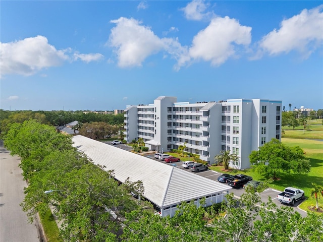 view of property featuring uncovered parking
