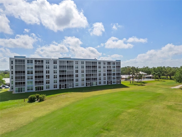 view of property's community with a yard