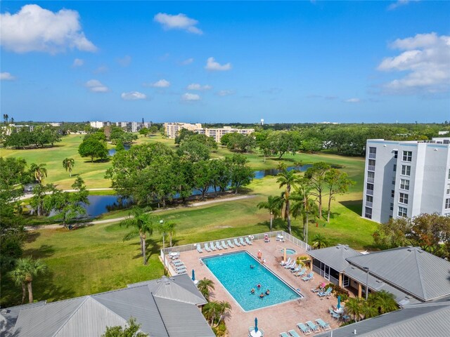 aerial view featuring golf course view and a water view