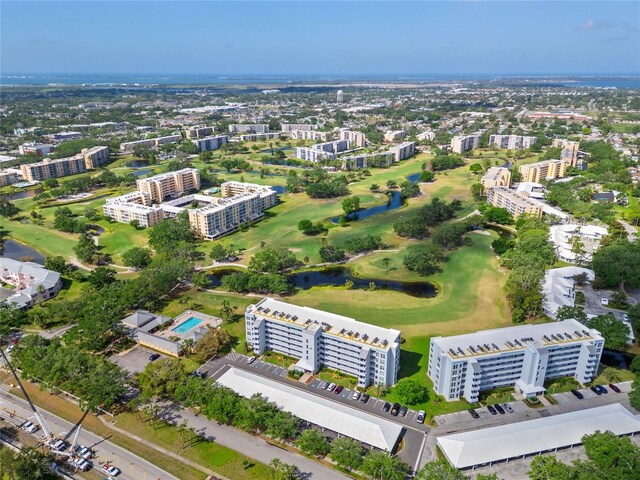 bird's eye view with golf course view and a city view