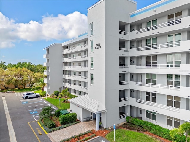 view of property with uncovered parking
