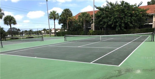 view of sport court with fence