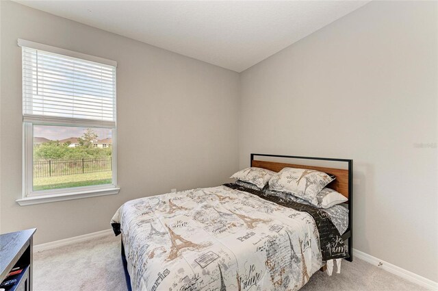 bedroom featuring baseboards and carpet floors