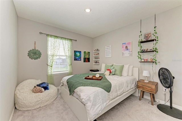bedroom with baseboards and carpet floors