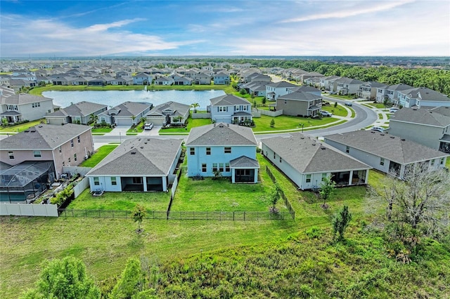 aerial view with a residential view and a water view