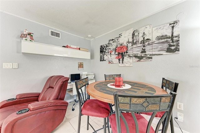 3053 Monica Pkwy, Sarasota, FL 34234 - tiled dining area with baseboards and visible vents