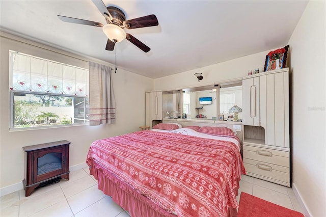3053 Monica Pkwy, Sarasota, FL 34234 - bedroom with a ceiling fan, baseboards, and light tile patterned floors