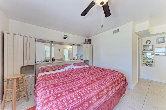 3053 Monica Pkwy, Sarasota, FL 34234 - bedroom with light tile patterned flooring, visible vents, baseboards, and ceiling fan
