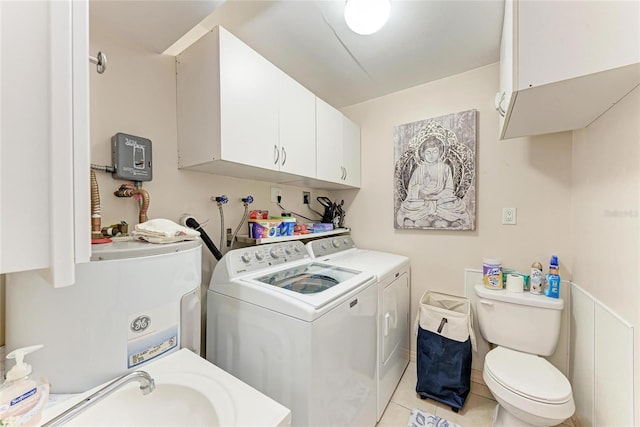 3053 Monica Pkwy, Sarasota, FL 34234 - bathroom featuring tile patterned floors, a sink, water heater, washing machine and dryer, and toilet