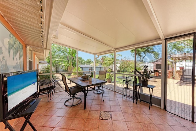3053 Monica Pkwy, Sarasota, FL 34234 - sunroom / solarium featuring beamed ceiling and plenty of natural light