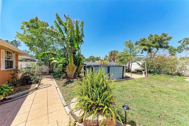 3053 Monica Pkwy, Sarasota, FL 34234 - view of yard with a fenced backyard and an outdoor pool
