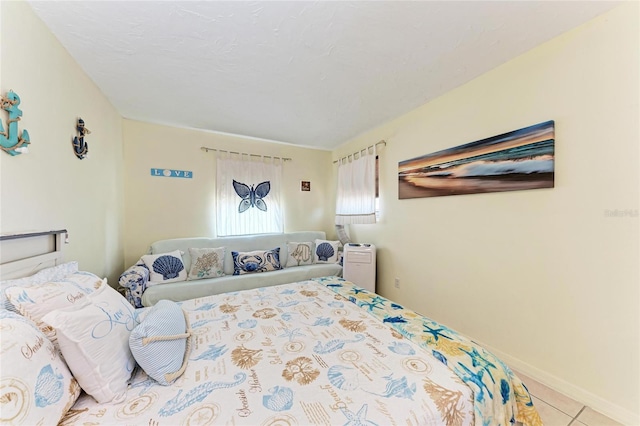 3053 Monica Pkwy, Sarasota, FL 34234 - tiled bedroom with baseboards