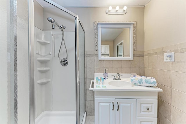 3053 Monica Pkwy, Sarasota, FL 34234 - bathroom featuring tile walls, vanity, and a stall shower