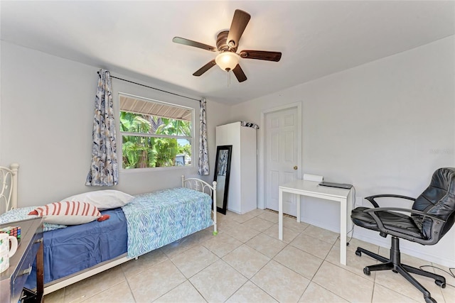 3053 Monica Pkwy, Sarasota, FL 34234 - bedroom with ceiling fan and light tile patterned floors