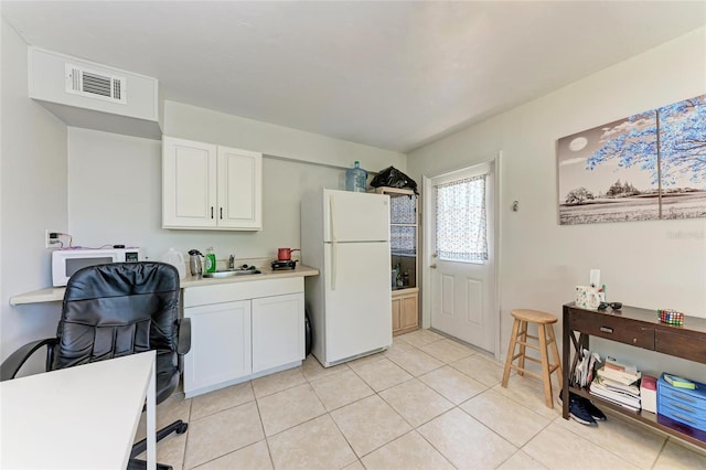 3053 Monica Pkwy, Sarasota, FL 34234 - kitchen featuring white cabinets, a sink, visible vents, white appliances, and light countertops