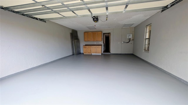 3409 Montilla Ct Unit 8410, Sarasota, FL 34232 - garage with baseboards and a garage door opener