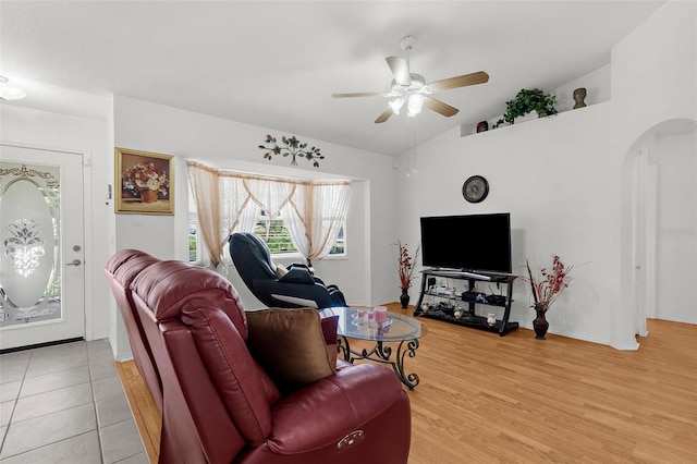 3459 Lotus Rd, North Port, FL 34291 - living area with light wood-style floors, a ceiling fan, lofted ceiling, baseboards, and arched walkways