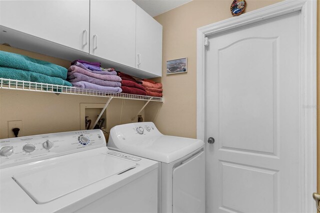 3459 Lotus Rd, North Port, FL 34291 - laundry room with washer and clothes dryer and cabinet space