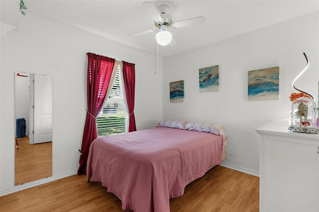 3459 Lotus Rd, North Port, FL 34291 - bedroom with a ceiling fan, baseboards, and wood finished floors