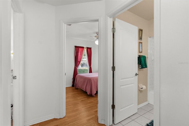 3459 Lotus Rd, North Port, FL 34291 - corridor featuring baseboards and light wood-style flooring