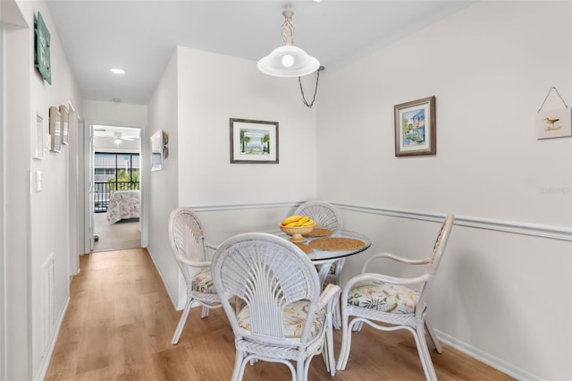 dining room with recessed lighting, wood finished floors, visible vents, and baseboards