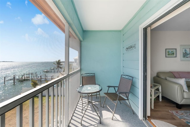 balcony featuring a water view
