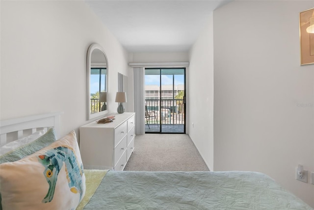 carpeted bedroom with access to exterior