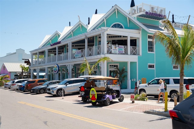 view of building exterior with uncovered parking