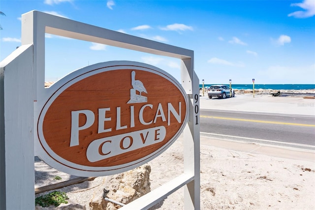 community sign with a water view