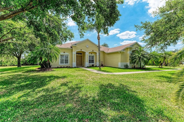 8136 Snowy Egret Pl, Bradenton, FL 34202 - view of front of home featuring stucco siding and a front yard