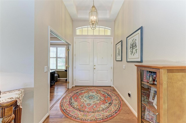 8136 Snowy Egret Pl, Bradenton, FL 34202 - entryway with wood finished floors and a chandelier
