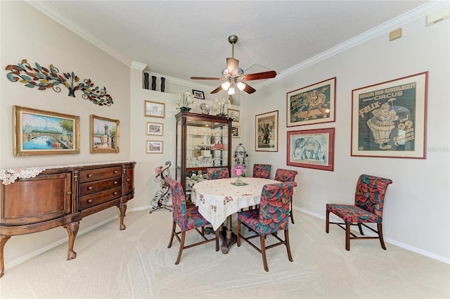 8136 Snowy Egret Pl, Bradenton, FL 34202 - dining room featuring light carpet, crown molding, ceiling fan, and a textured ceiling